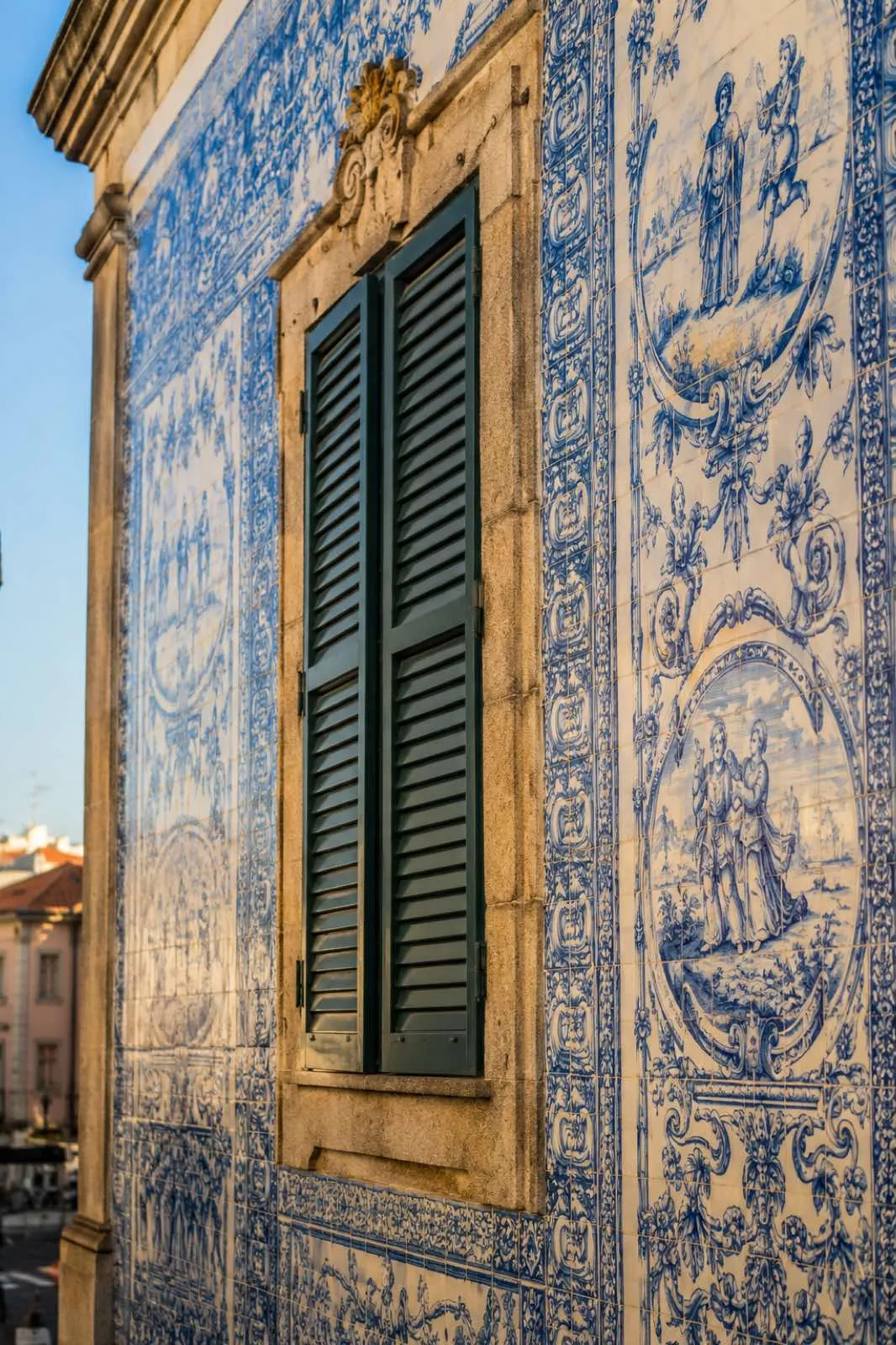 Blue azulejo facade with a green shutter